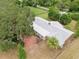 An aerial perspective captures the sprawling backyard and a brick patio, ideal for outdoor enjoyment and entertaining at 4802 Anton Ave, Apopka, FL 32712