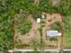 Aerial view with property lines of the property showcasing the home's location, lush surroundings, and lot size at 4802 Anton Ave, Apopka, FL 32712