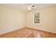Bedroom featuring a bright window, hardwood floors, and a ceiling fan, creating a cozy and well-lit retreat at 4802 Anton Ave, Apopka, FL 32712
