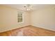 Bright and airy bedroom with hardwood floors, a large window, and ample natural light, creating a comfortable space at 4802 Anton Ave, Apopka, FL 32712