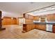 View of the eat-in kitchen with wood cabinetry and stainless steel appliances at 4802 Anton Ave, Apopka, FL 32712