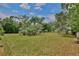 Expansive grassy lot with mature trees, perfect for building your dream home or enjoying outdoor activities at 4802 Anton Ave, Apopka, FL 32712