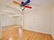 Living room featuring beautiful hardwood floors and natural light from the windows at 4802 Anton Ave, Apopka, FL 32712