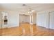 Bright living space with hardwood floors, multiple closets and views into the bathroom with a dark granite shower at 4802 Anton Ave, Apopka, FL 32712