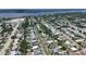 Panoramic aerial view of a residential area with tree-lined streets, diverse homes, and access to nearby waterways at 488 Golf Blvd, Daytona Beach, FL 32118