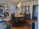 Inviting dining area with stylish light fixtures, a classic table, and decorative mirror, ideal for Gathering meals at 488 Golf Blvd, Daytona Beach, FL 32118