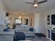 Comfortable living room with hardwood floors, a cozy fireplace, and plenty of natural light, creating a relaxing atmosphere at 488 Golf Blvd, Daytona Beach, FL 32118