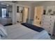 Bright and spacious bedroom with sliding mirrored closets and access to the bathroom, offering convenience and comfort at 488 Golf Blvd, Daytona Beach, FL 32118