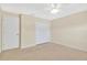 Bedroom with a ceiling fan, closet, and neutral carpet at 4952 Tangerine Ave # 4952, Winter Park, FL 32792