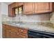 Kitchen features stainless steel sink, tile backsplash, and granite counters at 4952 Tangerine Ave # 4952, Winter Park, FL 32792