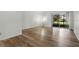 Bright living room features updated flooring and sliding glass doors at 4952 Tangerine Ave # 4952, Winter Park, FL 32792