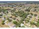 A high shot of a residential area showcasing well-maintained homes with mature trees at 5382 Sw 84Th Pl, Ocala, FL 34476