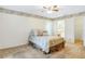 Cozy bedroom featuring a ceiling fan, patterned wallpaper, and plush carpeting at 5382 Sw 84Th Pl, Ocala, FL 34476