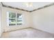 The bedroom has a window for natural light and is carpeted for comfort at 5382 Sw 84Th Pl, Ocala, FL 34476