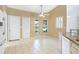 Bright breakfast nook features dual windows, tile flooring, and a ceiling fan at 5382 Sw 84Th Pl, Ocala, FL 34476