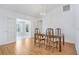 Formal dining room with wood floors and a chandelier next to an open doorway at 5382 Sw 84Th Pl, Ocala, FL 34476