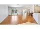 Spacious living room with wood floors and French doors for natural light at 5382 Sw 84Th Pl, Ocala, FL 34476
