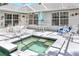 Back patio with furniture and an integrated hot tub at 5382 Sw 84Th Pl, Ocala, FL 34476