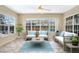 Sun room with tile floor, ceiling fan, and lots of natural light at 5382 Sw 84Th Pl, Ocala, FL 34476