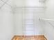 Walk-in closet with wire shelving and neutral carpeting at 5382 Sw 84Th Pl, Ocala, FL 34476