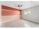 Bedroom with hardwood floors, a ceiling fan, and a window offering natural light at 540 Diane Cir, Casselberry, FL 32707