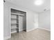 Bright bedroom features wood-look flooring and ample closet space at 540 Diane Cir, Casselberry, FL 32707