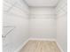 Walk-in closet with built-in shelving and modern flooring, offering ample storage space at 540 Diane Cir, Casselberry, FL 32707