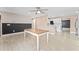 Spacious and open-concept dining area with tile floors, ceiling fan, and an open bar concept to the kitchen at 540 Diane Cir, Casselberry, FL 32707