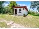 Charming exterior of a cozy home surrounded by greenery and ample yard space at 5671 Cypress Gardens Rd, Winter Haven, FL 33884