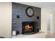 Classic stone fireplace with a stylish hearth and decorative mantel, adding warmth to the room at 5671 Cypress Gardens Rd, Winter Haven, FL 33884