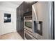 Modern kitchen with stainless steel appliances and sleek cabinets, ideal for culinary enthusiasts at 5671 Cypress Gardens Rd, Winter Haven, FL 33884