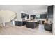 Spacious kitchen featuring dark cabinets, stainless steel appliances, and butcher block countertops at 5671 Cypress Gardens Rd, Winter Haven, FL 33884