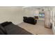 Comfortable living room area with recliner seating and entertainment center at 5671 Cypress Gardens Rd, Winter Haven, FL 33884