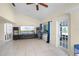 Bright living room with tile flooring and door to the outdoors at 5671 Cypress Gardens Rd, Winter Haven, FL 33884