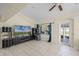 Bright living room with tile flooring and door to the outdoors at 5671 Cypress Gardens Rd, Winter Haven, FL 33884