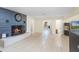Inviting living room with a stone fireplace and open layout, perfect for gatherings at 5671 Cypress Gardens Rd, Winter Haven, FL 33884