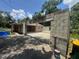 The rear exterior of the home features an expansion of concrete blocks and a spacious concrete slab at 625 E Jackson Ave, Mount Dora, FL 32757
