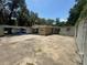 View of the rear of the home, expansion featuring concrete blocks and an expansive concrete slab at 625 E Jackson Ave, Mount Dora, FL 32757