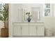 Bathroom featuring a dual sink vanity with white cabinetry and decor at 640 Terrapin Dr, Debary, FL 32713