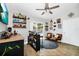 Entertaining space featuring a wet bar, comfortable seating, stylish decor, and a view of the outdoor patio at 7616 Simms Ave, Orlando, FL 32812