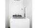Bright laundry room featuring a new, front-load washing machine at 7616 Simms Ave, Orlando, FL 32812