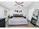 Relaxing bedroom showcases a queen-sized bed, stylish decor, and ample natural light at 7616 Simms Ave, Orlando, FL 32812