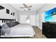 Spacious bedroom features two closets, light walls, and a large television at 7616 Simms Ave, Orlando, FL 32812