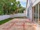 Exterior view of backyard featuring concrete patio, privacy fence, and green space at 879 Nonastone Run, Casselberry, FL 32707
