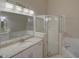 Bright bathroom featuring a stand up shower, jacuzzi tub, and granite countertops at 879 Nonastone Run, Casselberry, FL 32707