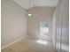 This is an empty bedroom featuring a ceiling fan, tile floors, and a view to the exterior at 879 Nonastone Run, Casselberry, FL 32707