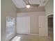 This is an empty bedroom with a ceiling fan, tile floors, and view to a closet at 879 Nonastone Run, Casselberry, FL 32707