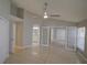 Spacious bedroom featuring tile floors, ceiling fan, and double door closet at 879 Nonastone Run, Casselberry, FL 32707