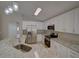 Modern kitchen with stainless steel appliances and speckled granite countertops at 879 Nonastone Run, Casselberry, FL 32707