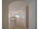 Hallway view to open-concept kitchen and living room layout at 879 Nonastone Run, Casselberry, FL 32707